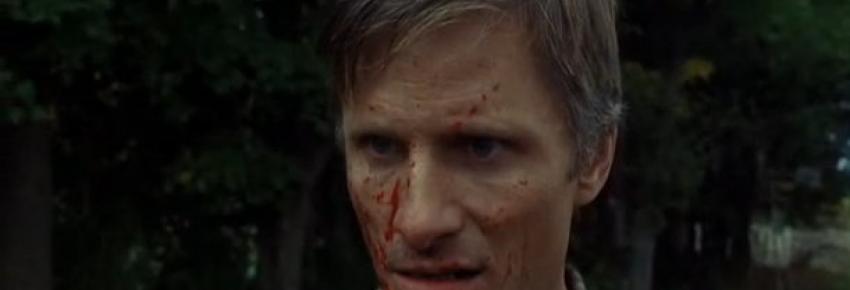 Tom stall (Vigo Mortensen), le visage couvert de sang